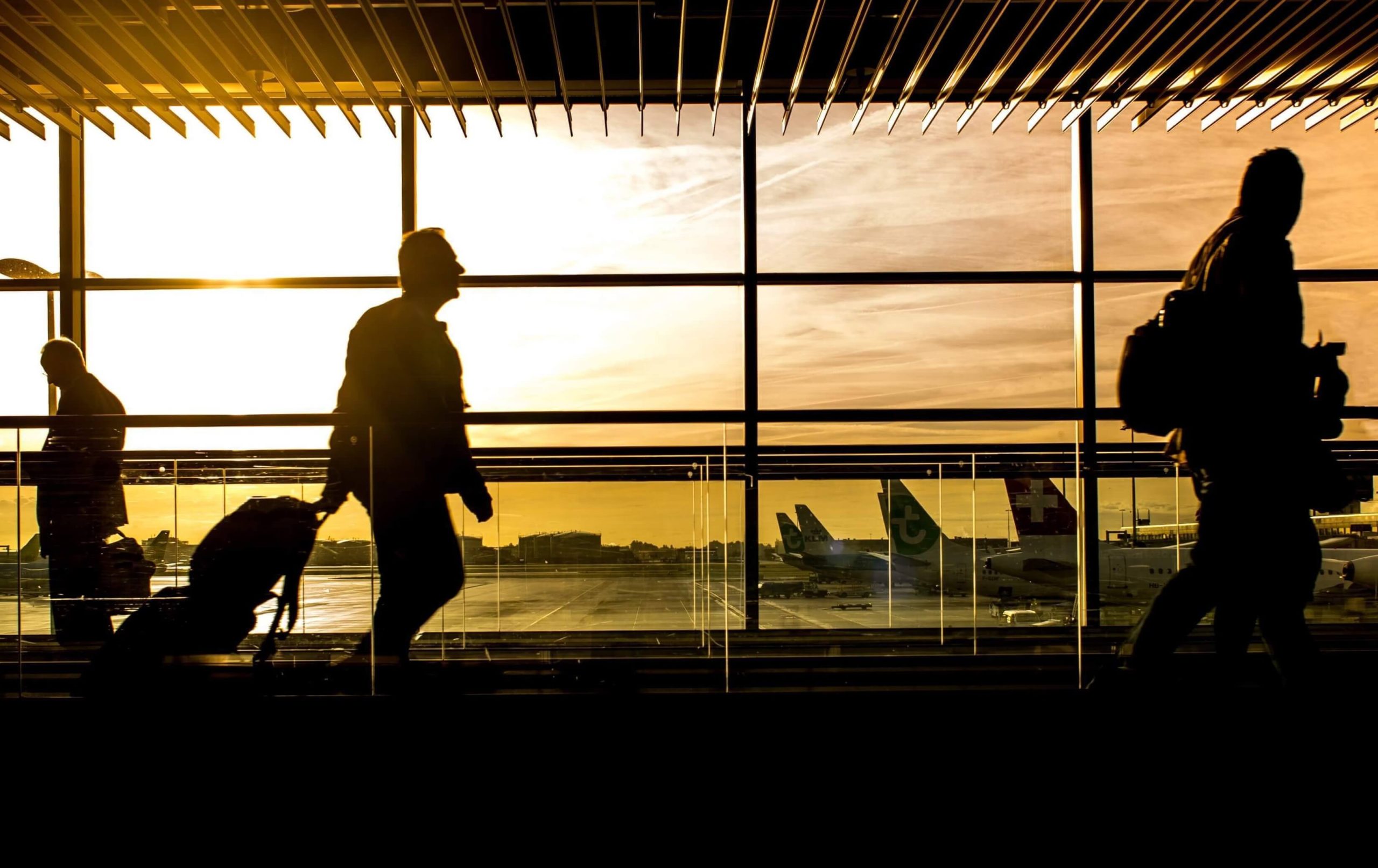 Silhouettes of people at the airport