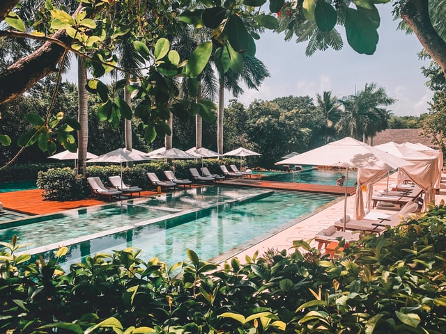 Sun loungers near a pool in Riviera Maya