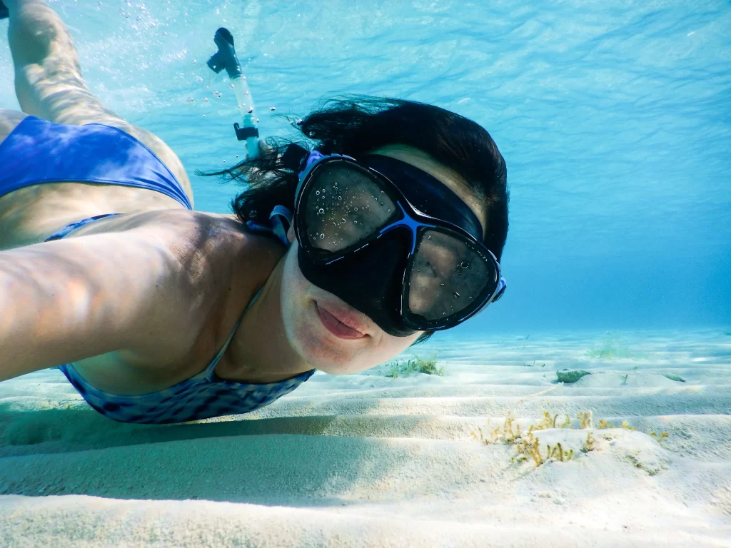 Girl snorkeling underwater in Cancun