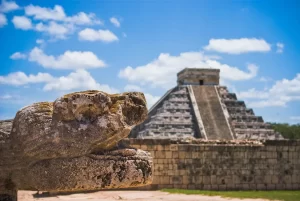 Temple of Kukulcan at Chichen Itza archeological site. Intricated architecture and mathematical precision, that aligns perfectly with the movements of the sun during the equinoxes, casting shadows that resemble a serpent descending the pyramid's steps. UNESCO world cultural heritage.